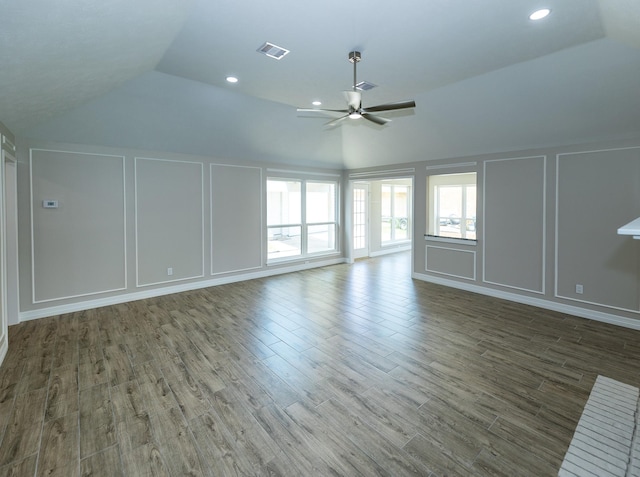 2414 Shoal Creek Dr, League City, TX 77573 - unfurnished living room with a decorative wall, lofted ceiling, a ceiling fan, wood finished floors, and recessed lighting
