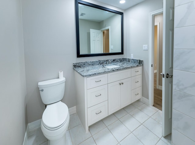 2414 Shoal Creek Dr, League City, TX 77573 - bathroom featuring toilet, baseboards, vanity, and tile patterned flooring