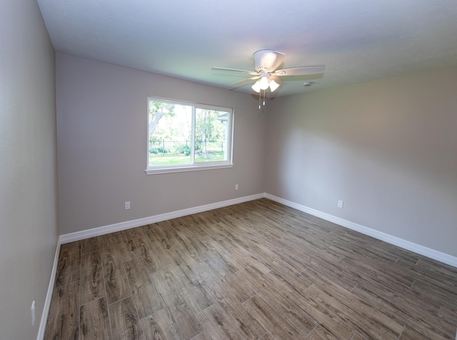 2414 Shoal Creek Dr, League City, TX 77573 - unfurnished room with ceiling fan, wood finished floors, and baseboards