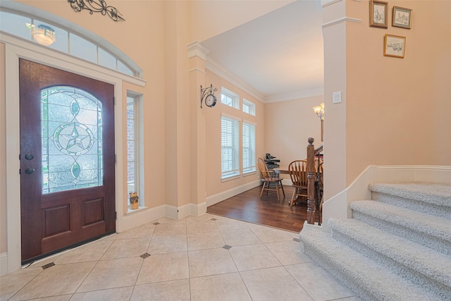 12607 Cove Landing Dr, Cypress, TX 77433 - tiled entrance foyer with healthy amount of natural light, crown molding, stairway, and baseboards