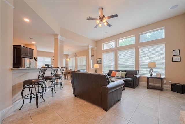 12607 Cove Landing Dr, Cypress, TX 77433 - living area featuring ornate columns, ceiling fan, plenty of natural light, light tile patterned floors, and recessed lighting