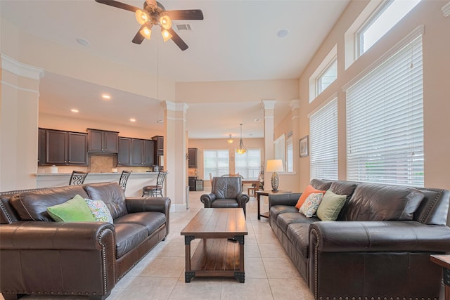 12607 Cove Landing Dr, Cypress, TX 77433 - living room featuring ceiling fan, plenty of natural light, light tile patterned floors, ornate columns, and recessed lighting