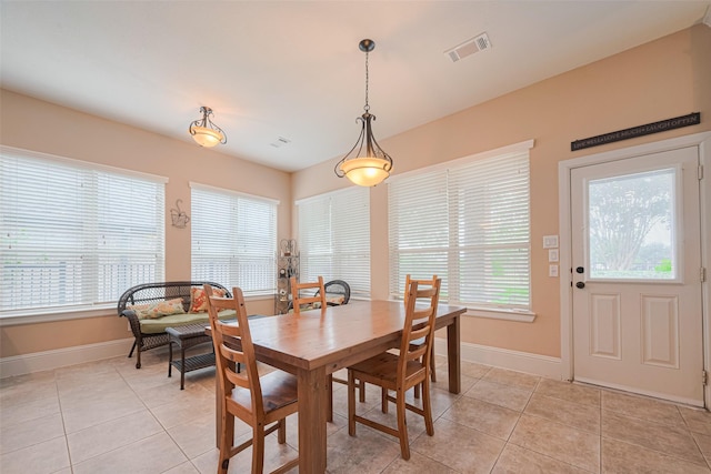 12607 Cove Landing Dr, Cypress, TX 77433 - dining room featuring light tile patterned floors and baseboards