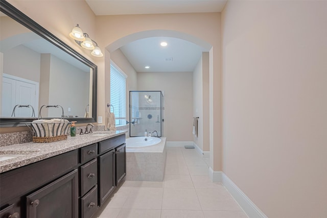 12607 Cove Landing Dr, Cypress, TX 77433 - full bathroom with a garden tub, tile patterned floors, an enclosed shower, double vanity, and baseboards