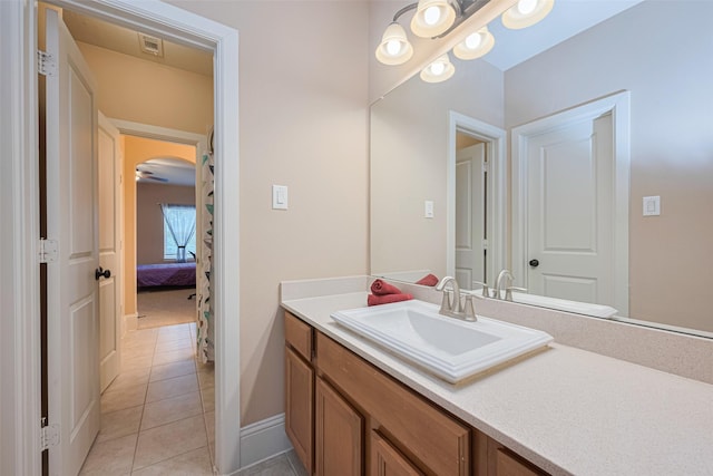 12607 Cove Landing Dr, Cypress, TX 77433 - ensuite bathroom featuring tile patterned floors, vanity, and baseboards