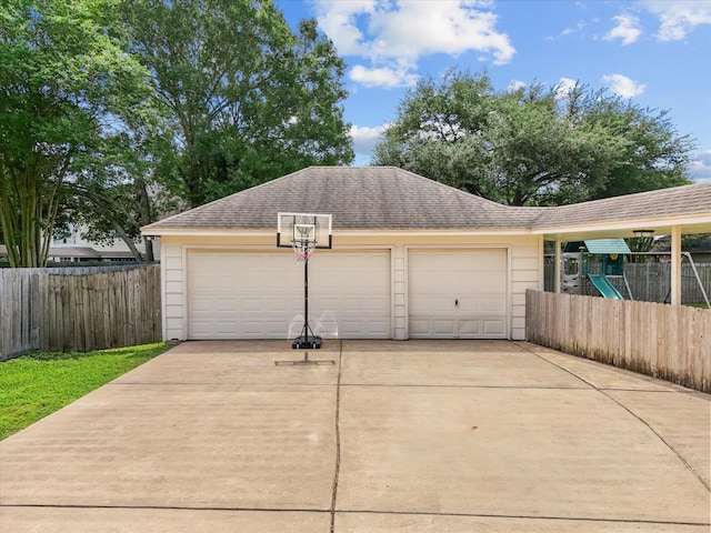 garage with fence
