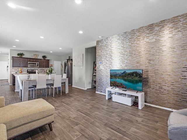 2419 Norwood Stand Trl, Spring, TX 77373 - living room featuring dark wood-style floors, recessed lighting, and baseboards