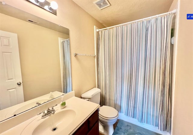 bathroom with toilet, vanity, a shower with shower curtain, and a textured ceiling