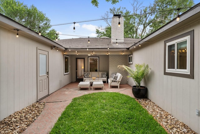 view of green lawn featuring outdoor lounge area and a patio area