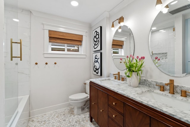 bathroom with toilet, double vanity, baseboards, and tile patterned floors