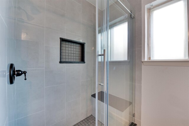 bathroom featuring a shower stall
