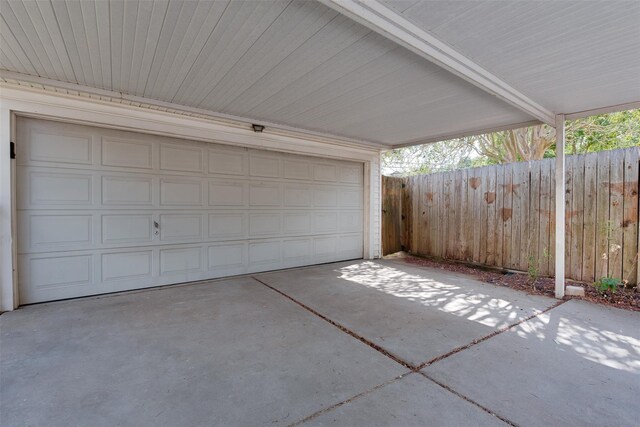 garage with fence