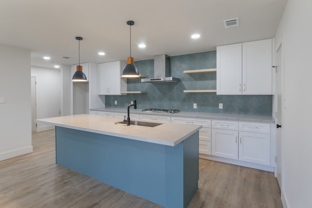 1710 Hafner Dr, Houston, TX 77055 - kitchen featuring wall chimney exhaust hood, a sink, open shelves, light wood-style floors, and tasteful backsplash