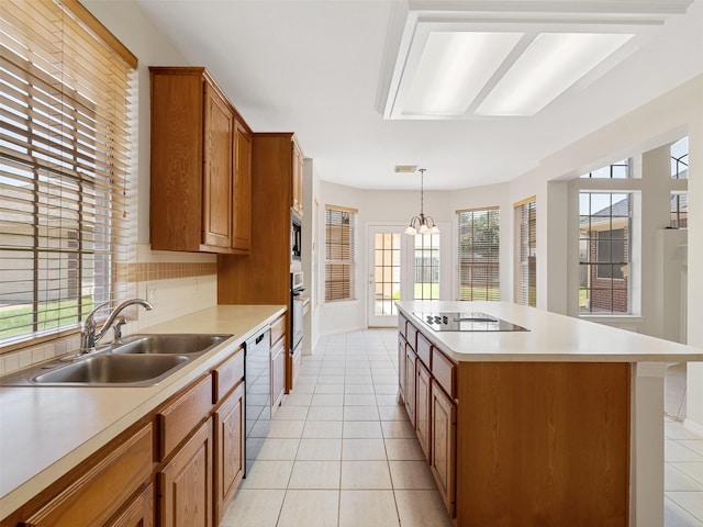 23334 Fairbranch Dr, Katy, TX 77494 - kitchen with a sink, black electric stovetop, wall oven, dishwasher, and light countertops