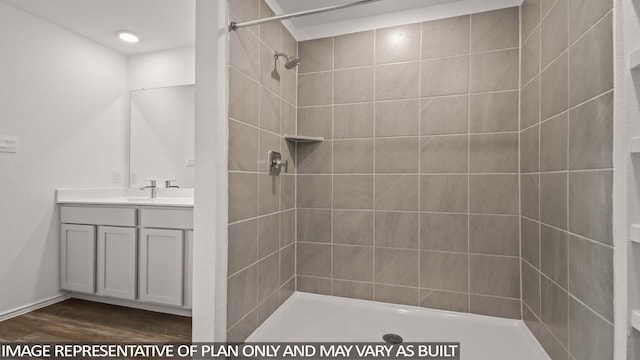 1346 Heather Rosewood Ln, Conroe, TX 77301 - full bath with vanity, wood finished floors, and tiled shower