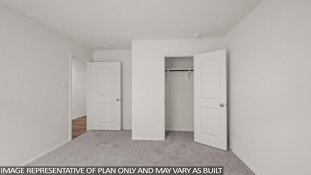 1346 Heather Rosewood Ln, Conroe, TX 77301 - unfurnished bedroom with carpet flooring, a closet, and baseboards