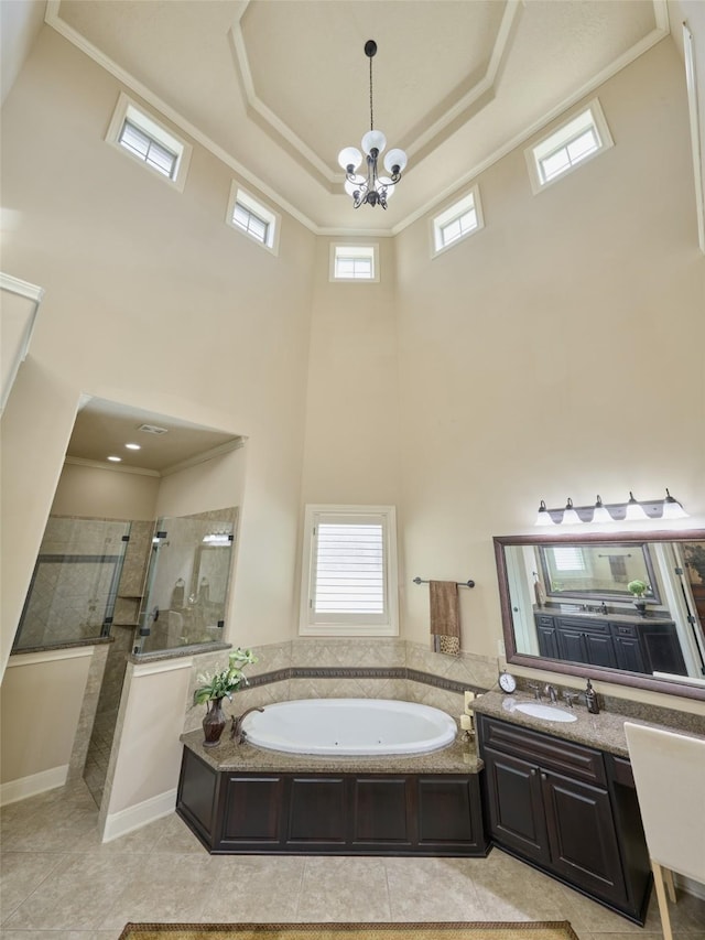 full bathroom featuring a walk in shower, a bath, a high ceiling, a chandelier, and vanity
