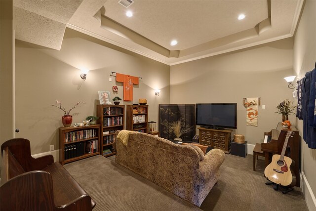 living room featuring carpet, a tray ceiling, recessed lighting, and crown molding