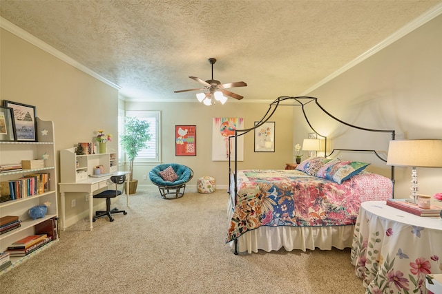 carpeted bedroom featuring ornamental molding, a textured ceiling, ceiling fan, baseboards, and a desk