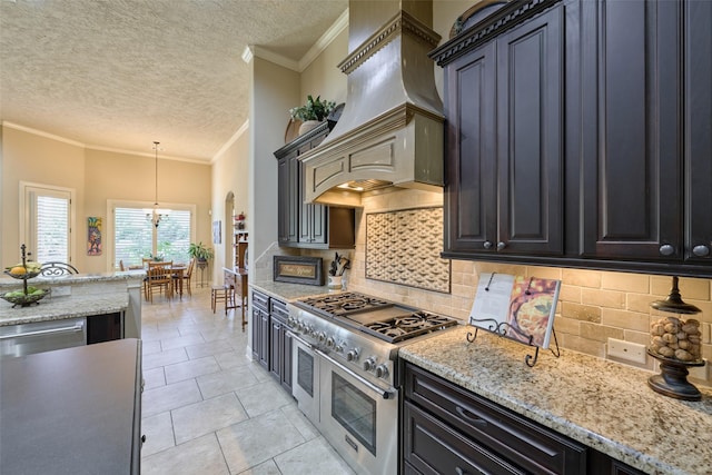 kitchen featuring stainless steel appliances, custom range hood, a textured ceiling, ornamental molding, and tasteful backsplash