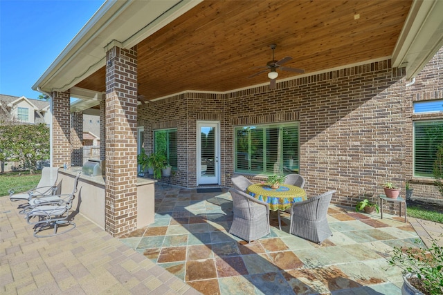 view of patio featuring ceiling fan and outdoor dining space