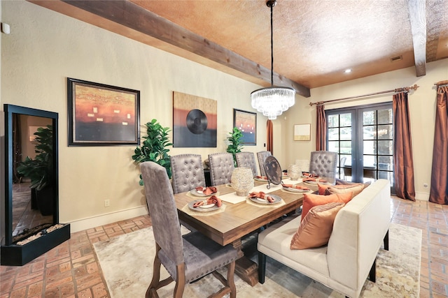 13315 Timberwild Ct, Tomball, TX 77375 - dining space with brick floors, a textured ceiling, beam ceiling, baseboards, and french doors
