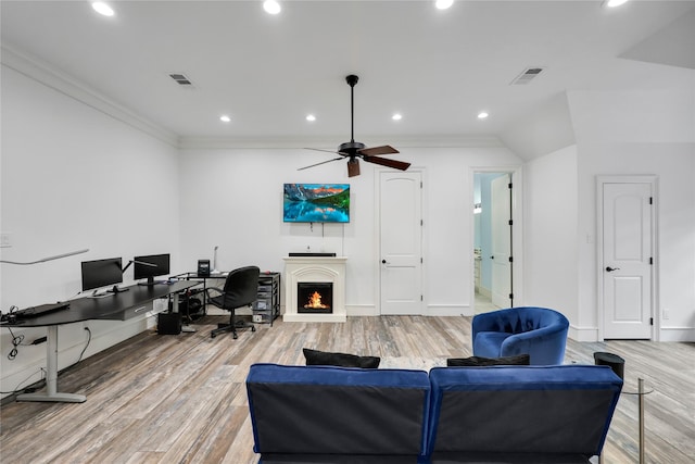 13315 Timberwild Ct, Tomball, TX 77375 - living room featuring an office area, light wood-style flooring, recessed lighting, a ceiling fan, and a lit fireplace