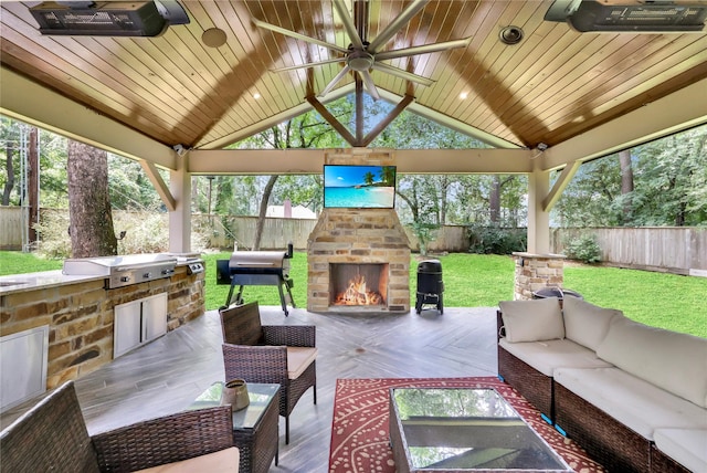 13315 Timberwild Ct, Tomball, TX 77375 - view of patio featuring a gazebo, ceiling fan, an outdoor living space with a fireplace, grilling area, and exterior kitchen