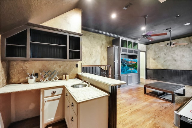 13315 Timberwild Ct, Tomball, TX 77375 - kitchen featuring a ceiling fan, a sink, light wood finished floors, open shelves, and light stone counters