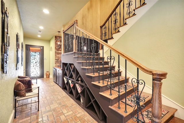 13315 Timberwild Ct, Tomball, TX 77375 - wine cellar with arched walkways, brick flooring, and recessed lighting