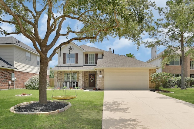 traditional-style home featuring an attached garage, a front yard, concrete driveway, roof with shingles, and brick siding