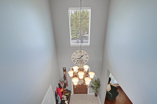 detailed view of a chandelier and baseboards