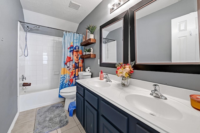 bathroom featuring toilet, tile patterned flooring, shower / tub combo with curtain, double vanity, and baseboards