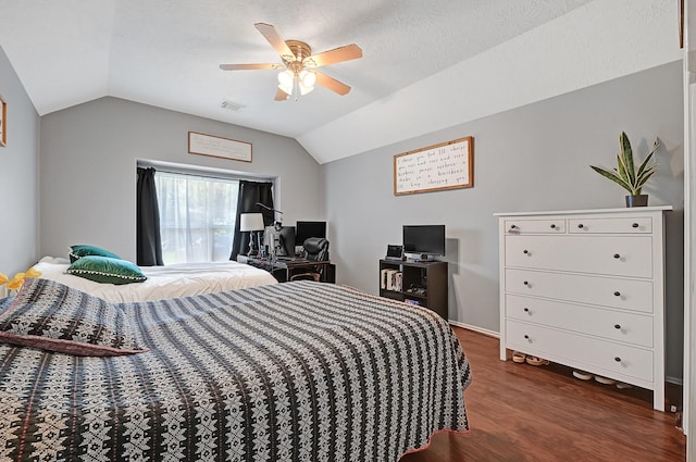 bedroom with lofted ceiling, wood finished floors, and ceiling fan