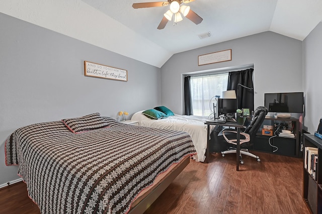 bedroom featuring vaulted ceiling, wood finished floors, and ceiling fan