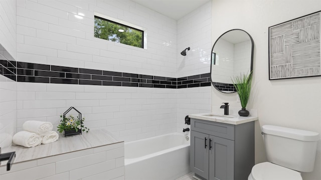 full bath featuring toilet, vanity, and shower / bathtub combination