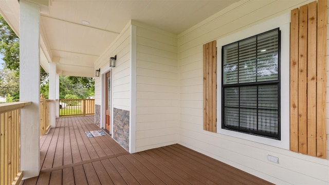 wooden terrace featuring a porch