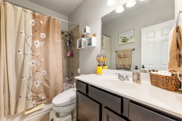 bathroom with vanity, shower / tub combo with curtain, and toilet