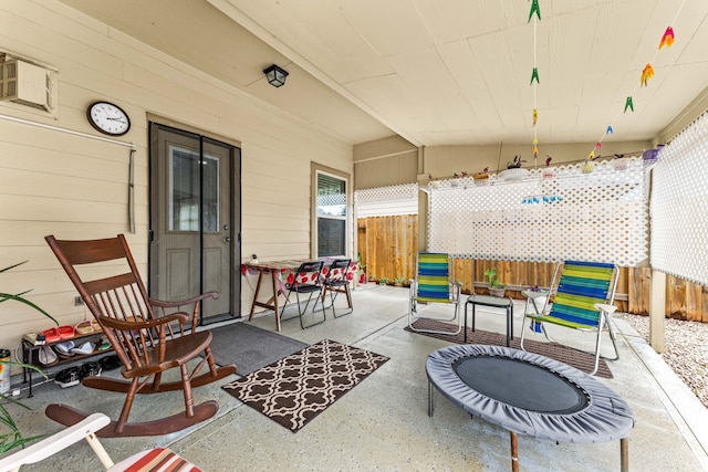 view of patio / terrace featuring fence