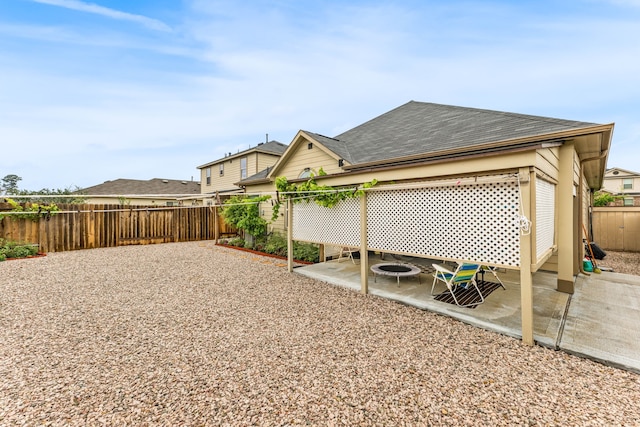 fenced backyard with a patio