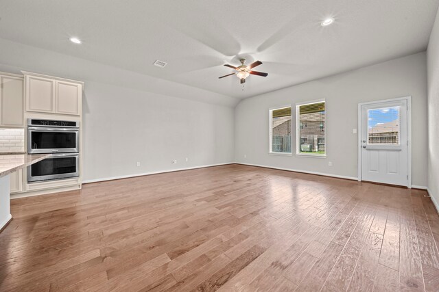 15423 Hopkins Cedar Dr, Humble, TX 77346 - unfurnished living room with ceiling fan, light wood-type flooring, baseboards, and recessed lighting