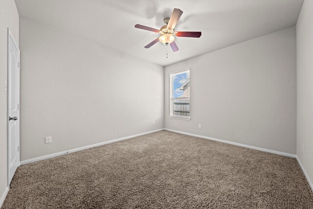 15423 Hopkins Cedar Dr, Humble, TX 77346 - spare room featuring carpet flooring, a ceiling fan, and baseboards