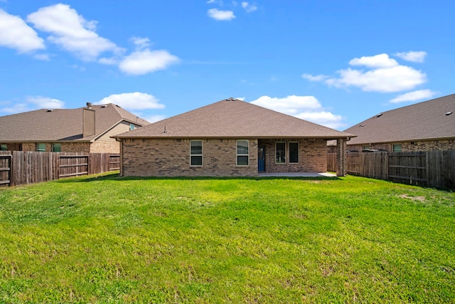 15423 Hopkins Cedar Dr, Humble, TX 77346 - back of property with a patio, brick siding, and a shingled roof