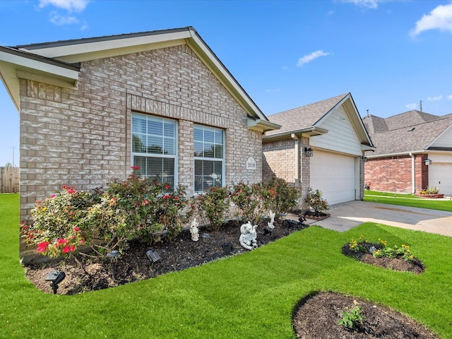 20118 Lakespire Dr, Katy, TX 77449 - single story home featuring a garage, a front yard, driveway, and brick siding