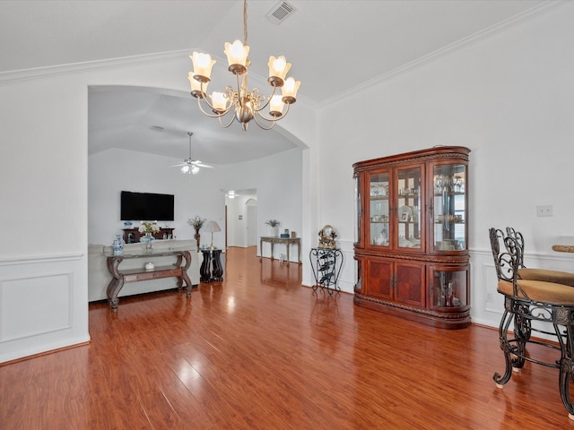 20118 Lakespire Dr, Katy, TX 77449 - dining room with arched walkways, ceiling fan, wood finished floors, a chandelier, and vaulted ceiling
