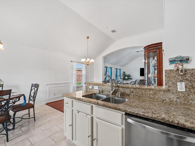 20118 Lakespire Dr, Katy, TX 77449 - kitchen with stainless steel dishwasher, a sink, a chandelier, backsplash, and white cabinets