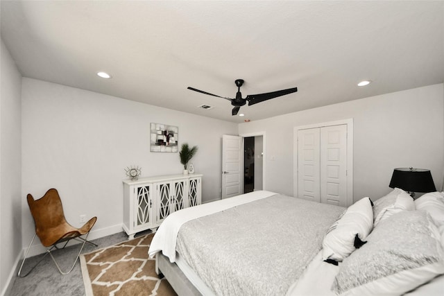 carpeted bedroom featuring recessed lighting, baseboards, a ceiling fan, and a closet