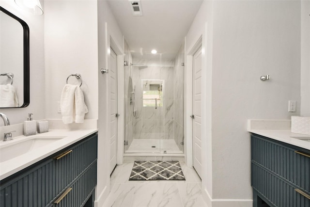 bathroom featuring marble finish flooring, a marble finish shower, two vanities, baseboards, and recessed lighting