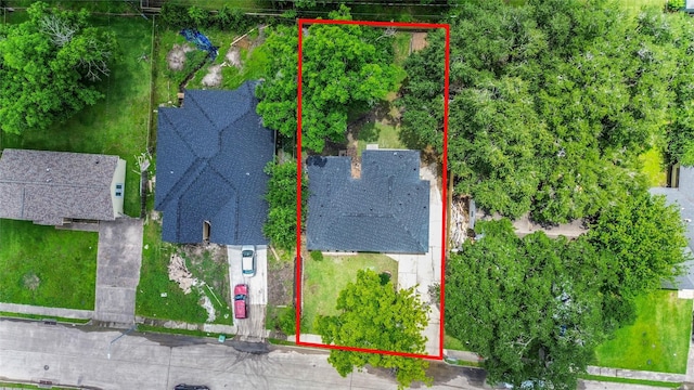 aerial view of property and surrounding area with property parcel outlined