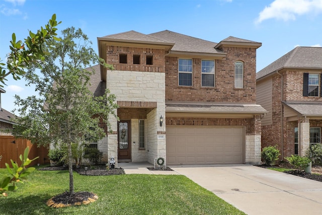 2510 Ocean Key Dr, Texas City, TX 77568 - view of front of house with a garage, driveway, brick siding, and stone siding